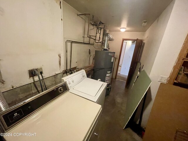 4312 E 6th Ave, Anchorage, AK 99508 - washroom with gas water heater and washer and dryer
