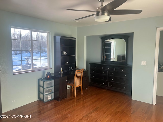 office space featuring dark wood-type flooring and ceiling fan