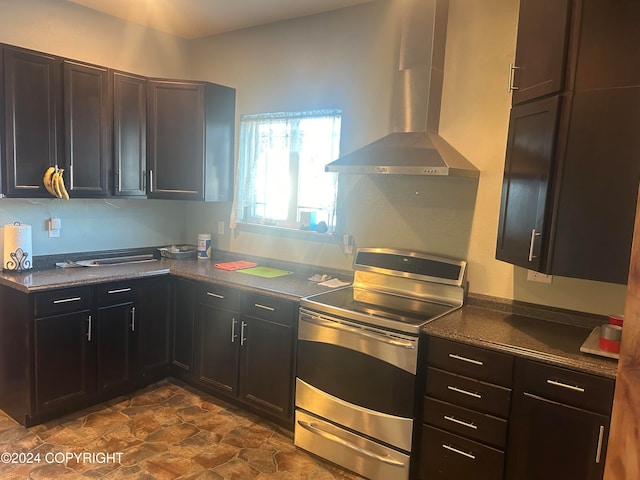 kitchen with ventilation hood and stainless steel range with electric stovetop