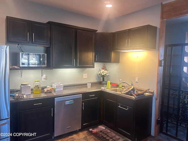 kitchen featuring stainless steel dishwasher and sink