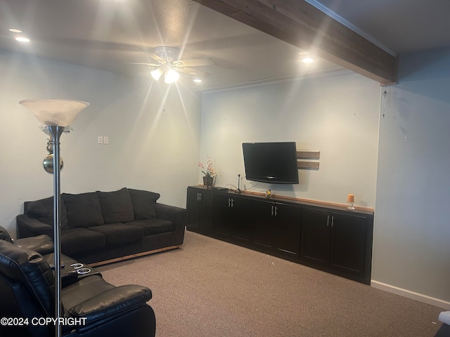 living room with carpet, ceiling fan, crown molding, and beam ceiling