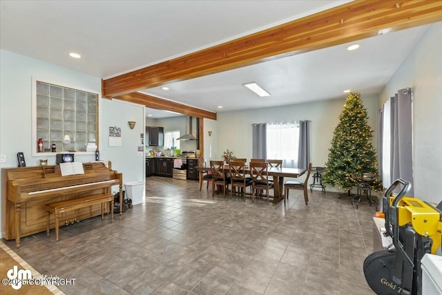 dining space with beam ceiling