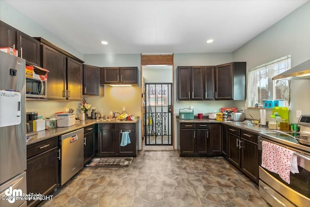 kitchen with appliances with stainless steel finishes and dark brown cabinetry