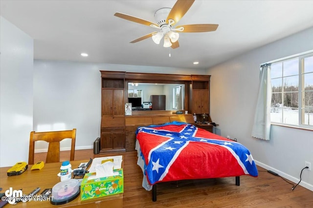 bedroom featuring hardwood / wood-style floors and ceiling fan