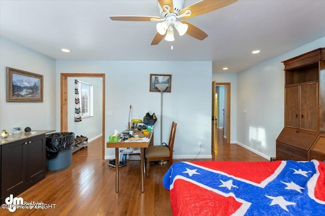 bedroom featuring dark hardwood / wood-style flooring and ceiling fan