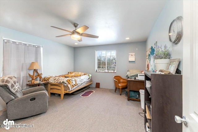 bedroom featuring ceiling fan and carpet