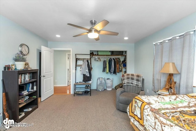 bedroom with carpet floors, a closet, and ceiling fan