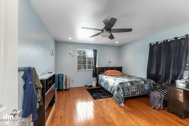 bedroom featuring hardwood / wood-style floors and ceiling fan