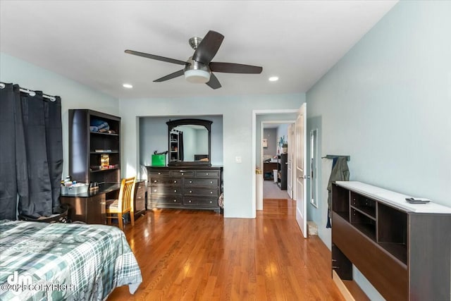 bedroom with hardwood / wood-style flooring and ceiling fan