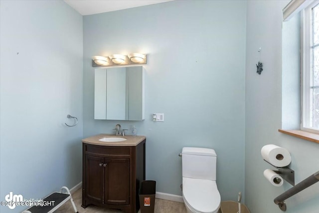 bathroom featuring toilet and vanity