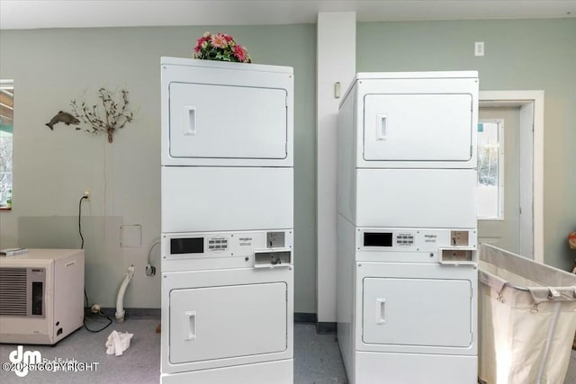 laundry room featuring independent washer and dryer and stacked washer and clothes dryer