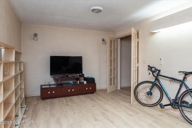 living room featuring baseboards and wood finished floors