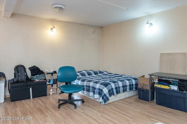 bedroom with wood finished floors