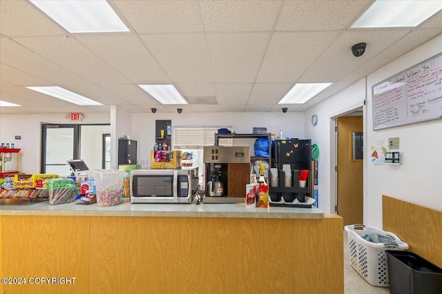 kitchen featuring a paneled ceiling