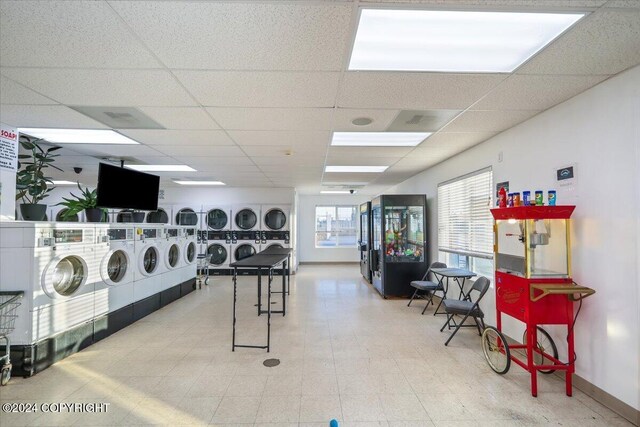 3462 S Big Lake Rd, Big Lake, AK 99623 - shared laundry room with stacked washer / drying machine, washing machine and dryer, and baseboards