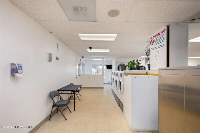 laundry room featuring stacked washer and clothes dryer and separate washer and dryer