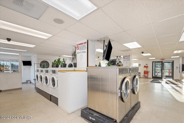 clothes washing area featuring washer and clothes dryer