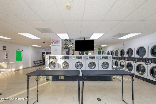 laundry room with stacked washer / dryer and washing machine and clothes dryer