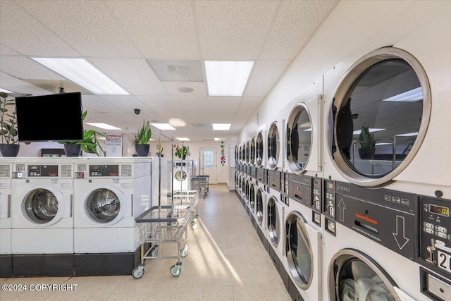 washroom with washer and clothes dryer and stacked washer and dryer