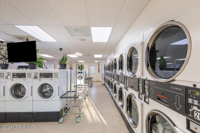 3462 S Big Lake Rd, Big Lake, AK 99623 - shared laundry room featuring stacked washer and clothes dryer, washing machine and dryer, and tile patterned floors
