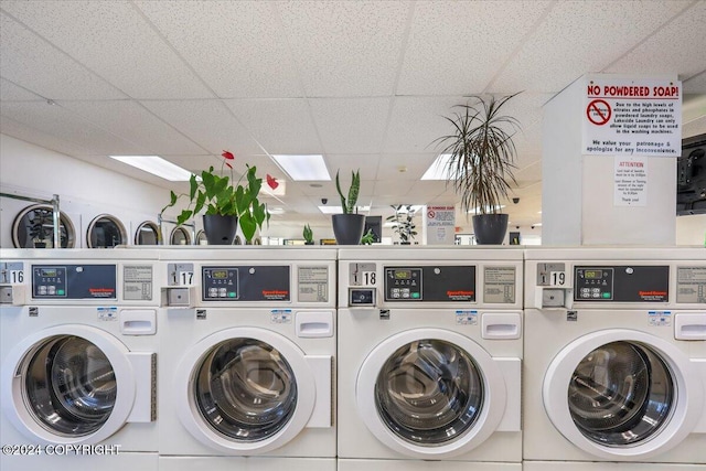 laundry room featuring washing machine and clothes dryer