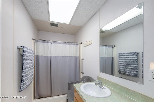 bathroom with walk in shower and vanity