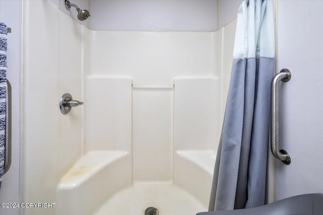 bathroom with a shower with shower curtain