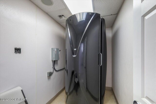 3462 S Big Lake Rd, Big Lake, AK 99623 - detailed view of refrigerator and baseboards