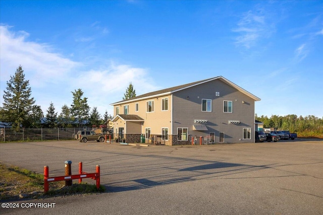 3462 S Big Lake Rd, Big Lake, AK 99623 - rear view of house featuring uncovered parking and fence