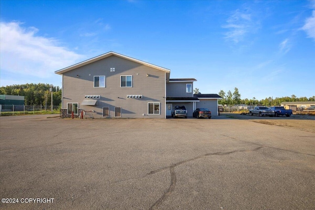 back of property with a garage