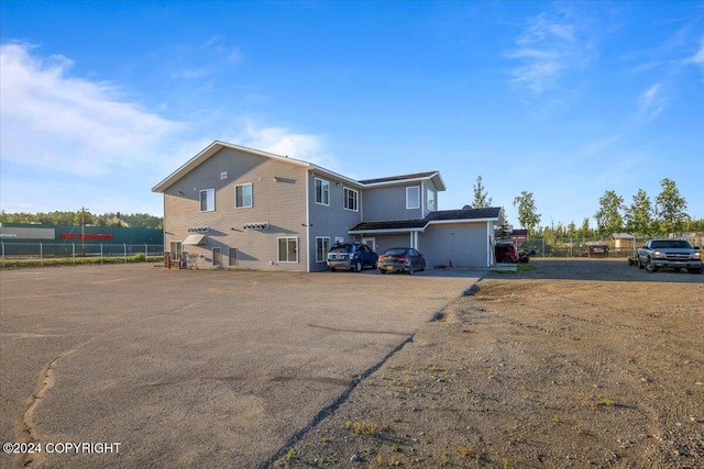 back of property featuring a garage