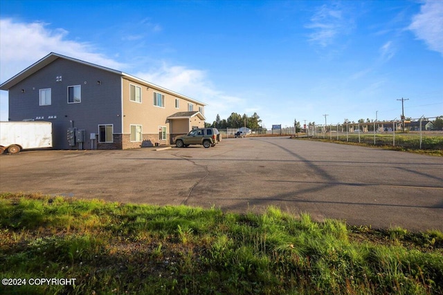 rear view of property with a garage