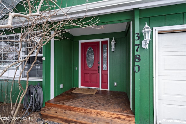 property entrance with a garage