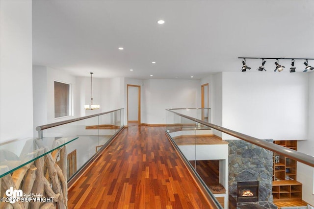 corridor featuring hardwood / wood-style floors