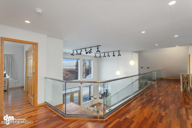 corridor featuring dark hardwood / wood-style flooring