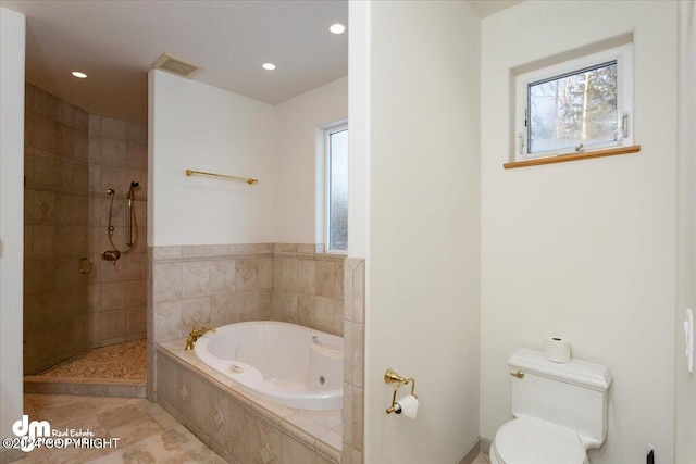 bathroom with plus walk in shower, tile patterned floors, and toilet