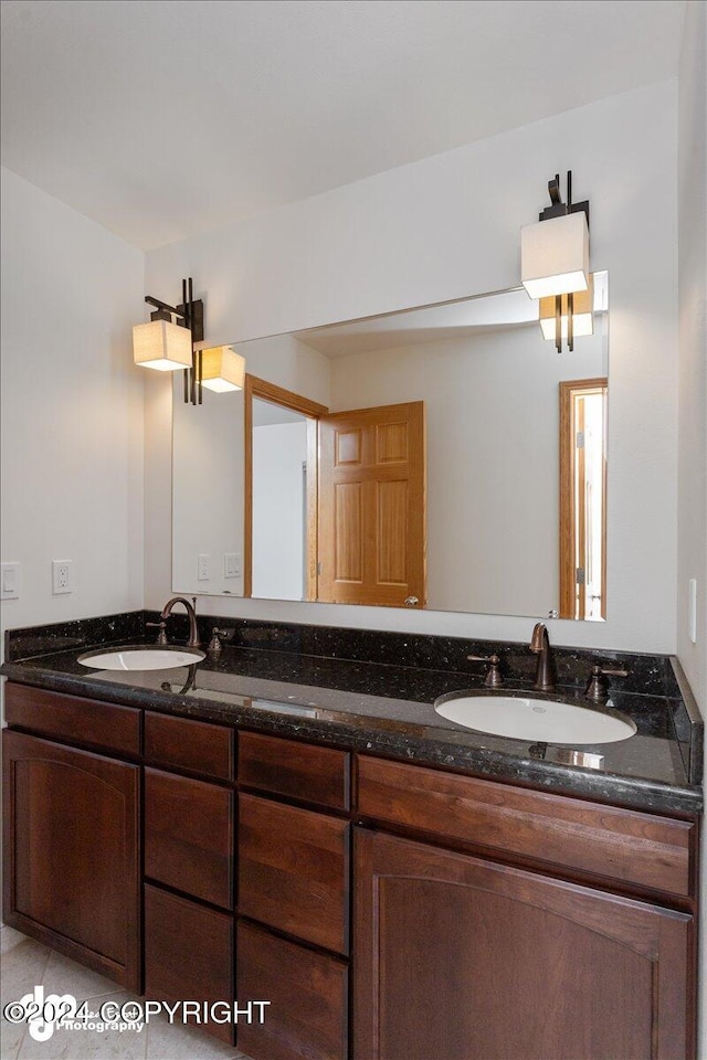 bathroom featuring tile patterned floors and vanity