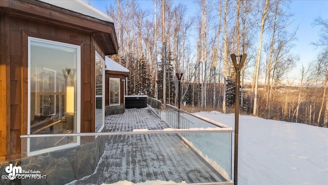 view of snow covered deck