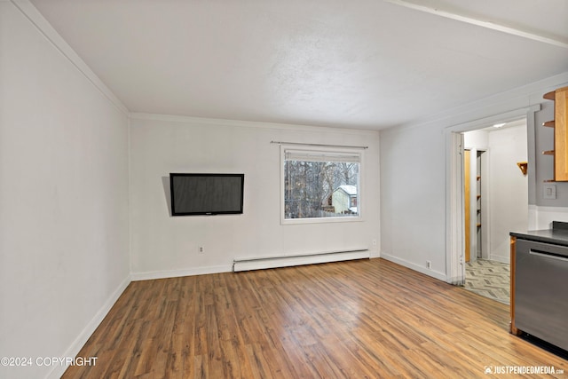 unfurnished living room with crown molding, baseboards, baseboard heating, and wood finished floors