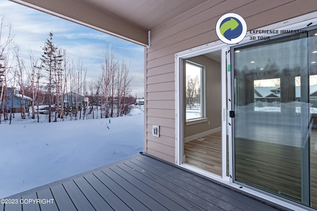 view of snow covered deck