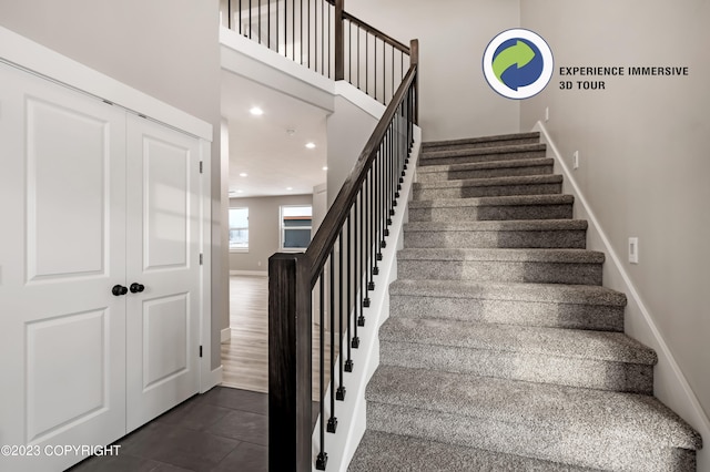 stairway featuring hardwood / wood-style flooring