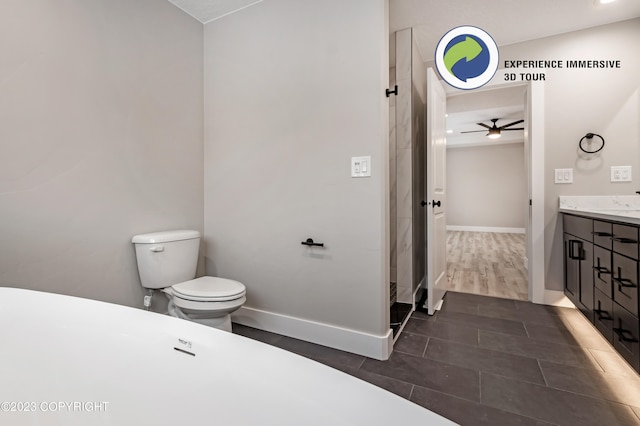 bathroom featuring ceiling fan, toilet, and vanity