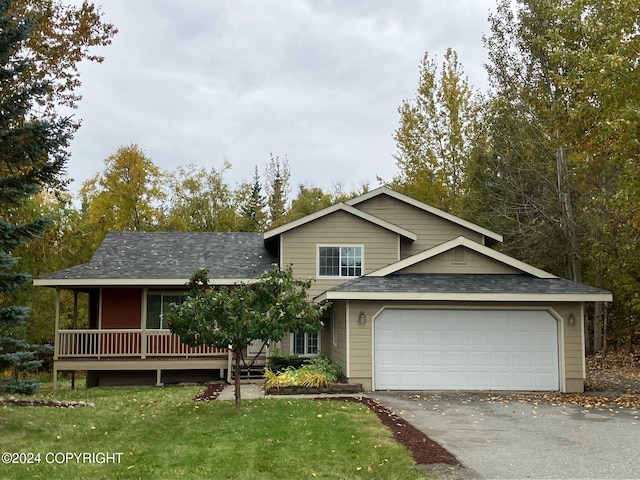 view of front of house featuring a garage and a front yard