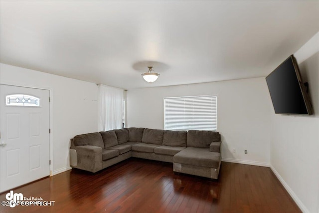 unfurnished living room with dark hardwood / wood-style flooring