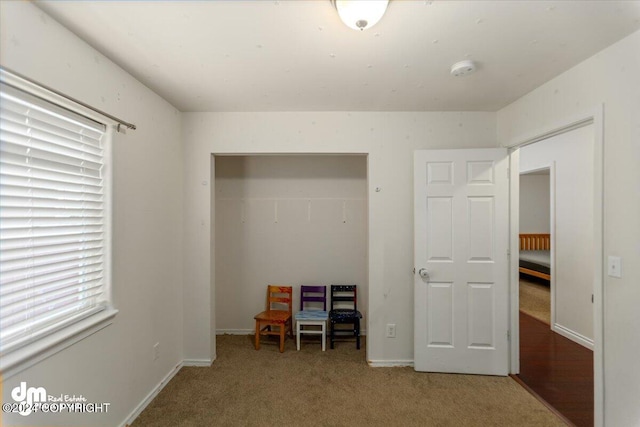 unfurnished bedroom with carpet and a closet