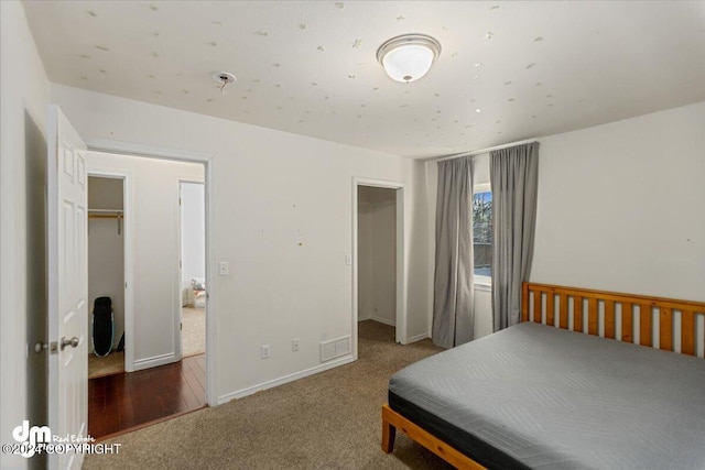 carpeted bedroom with a closet