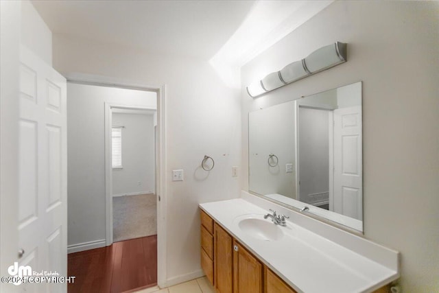 bathroom featuring hardwood / wood-style floors and vanity