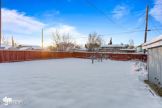 view of yard covered in snow