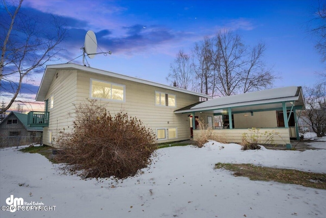 view of snow covered house