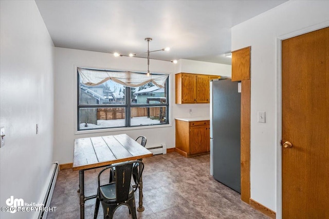 dining room featuring a baseboard heating unit